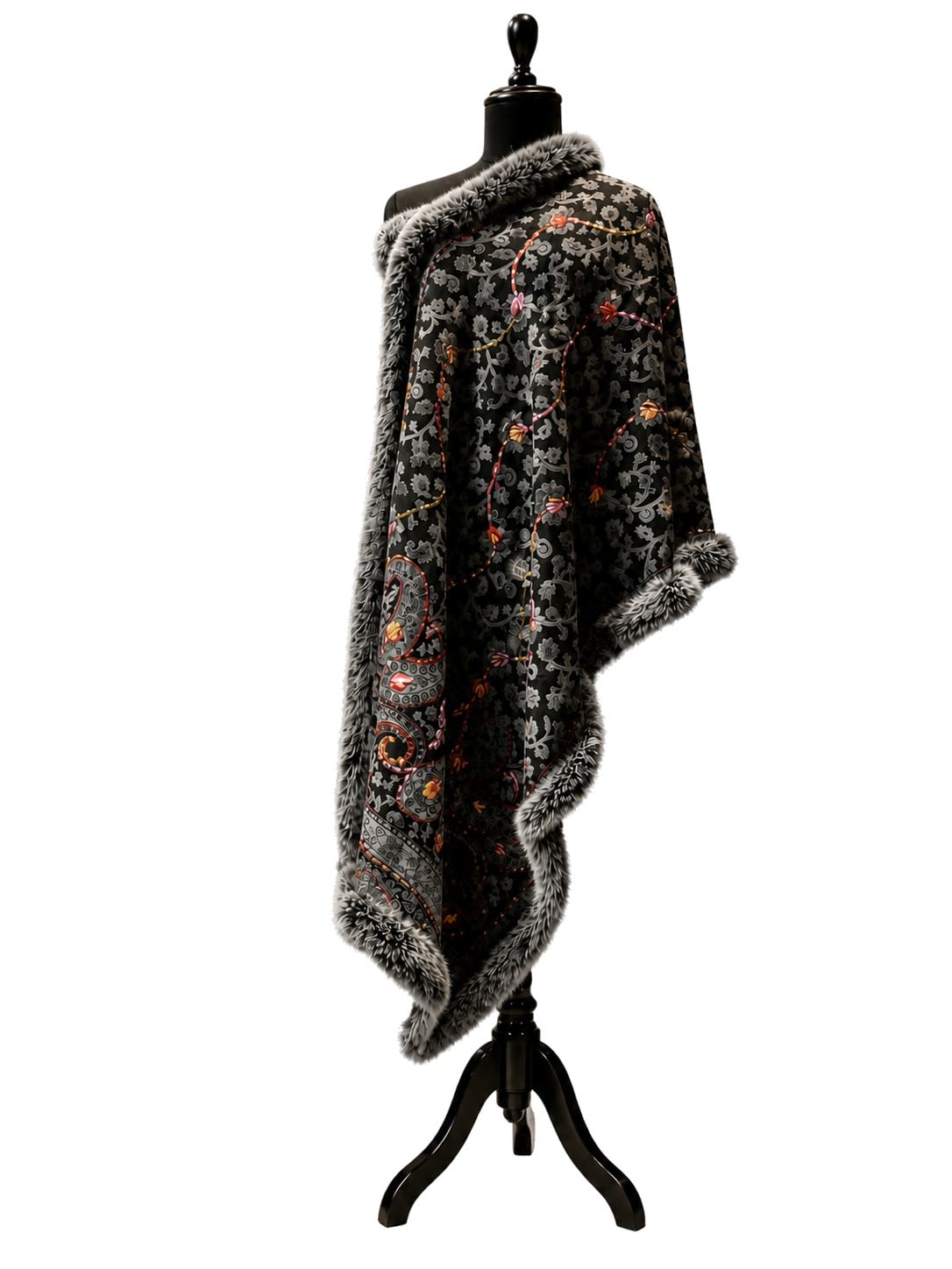 Dark floral textile draped over a mannequin in a warm studio