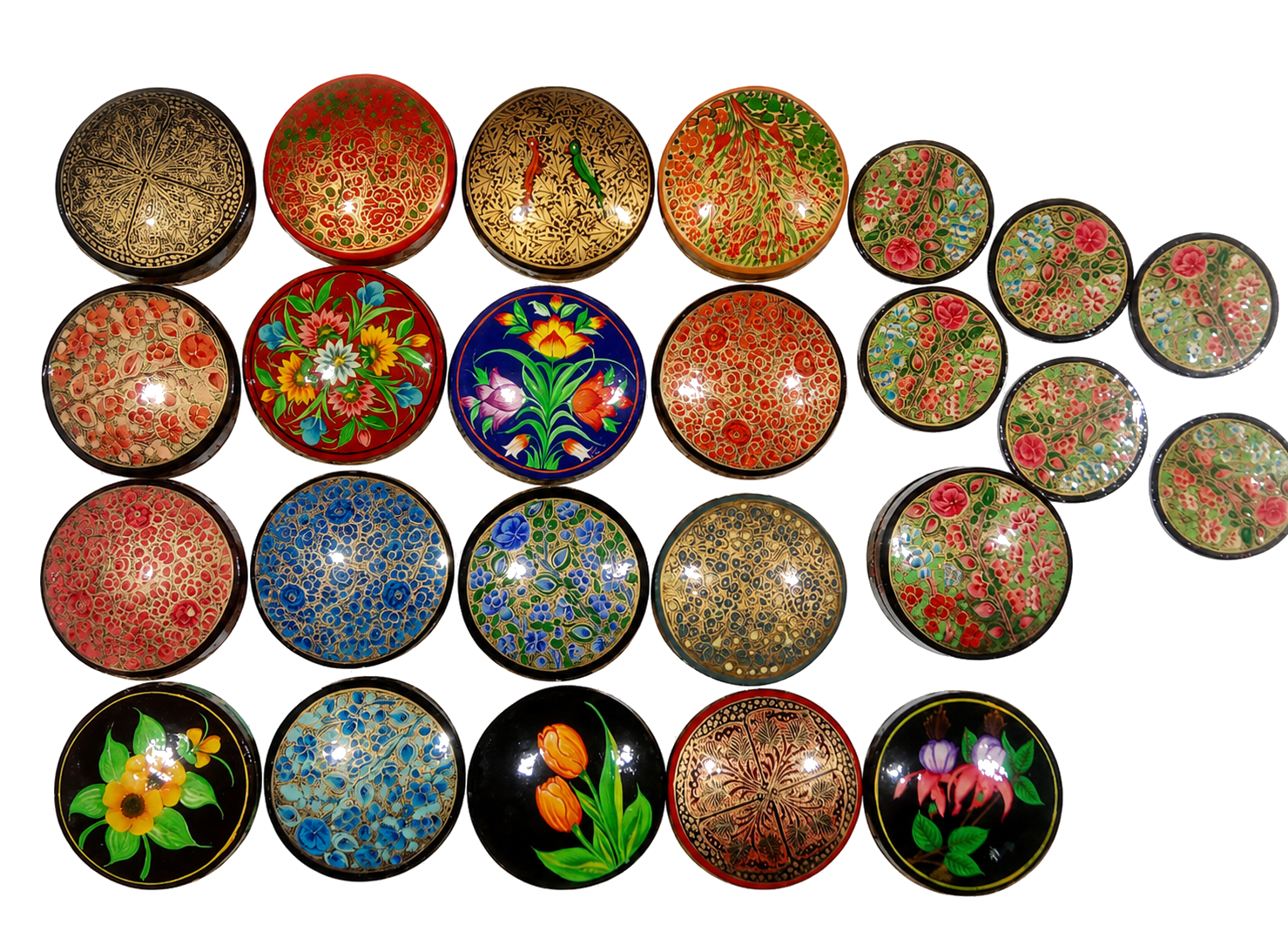 Collection of colourful hand-painted round objects arranged against a white wall